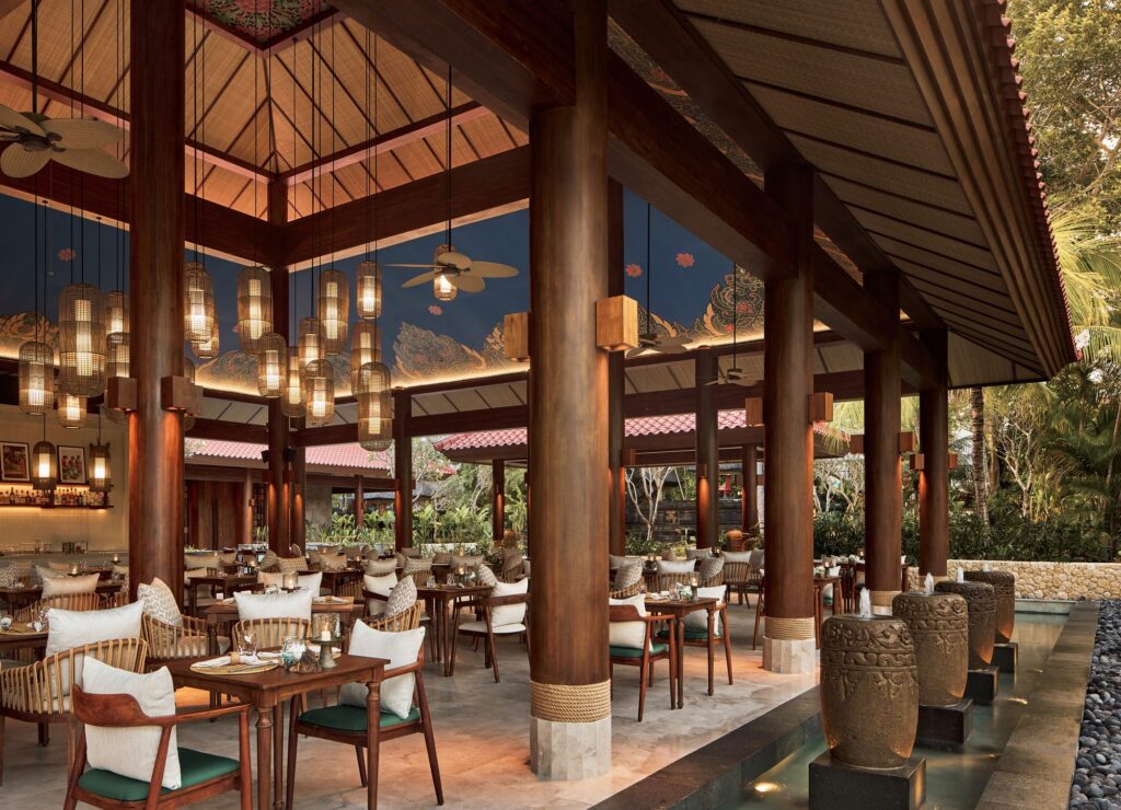 ARUM Asian restaurant at Paradisus by Meliá Bali, an open pavilion with rattan lanterns and a painted ceiling beside a water feature