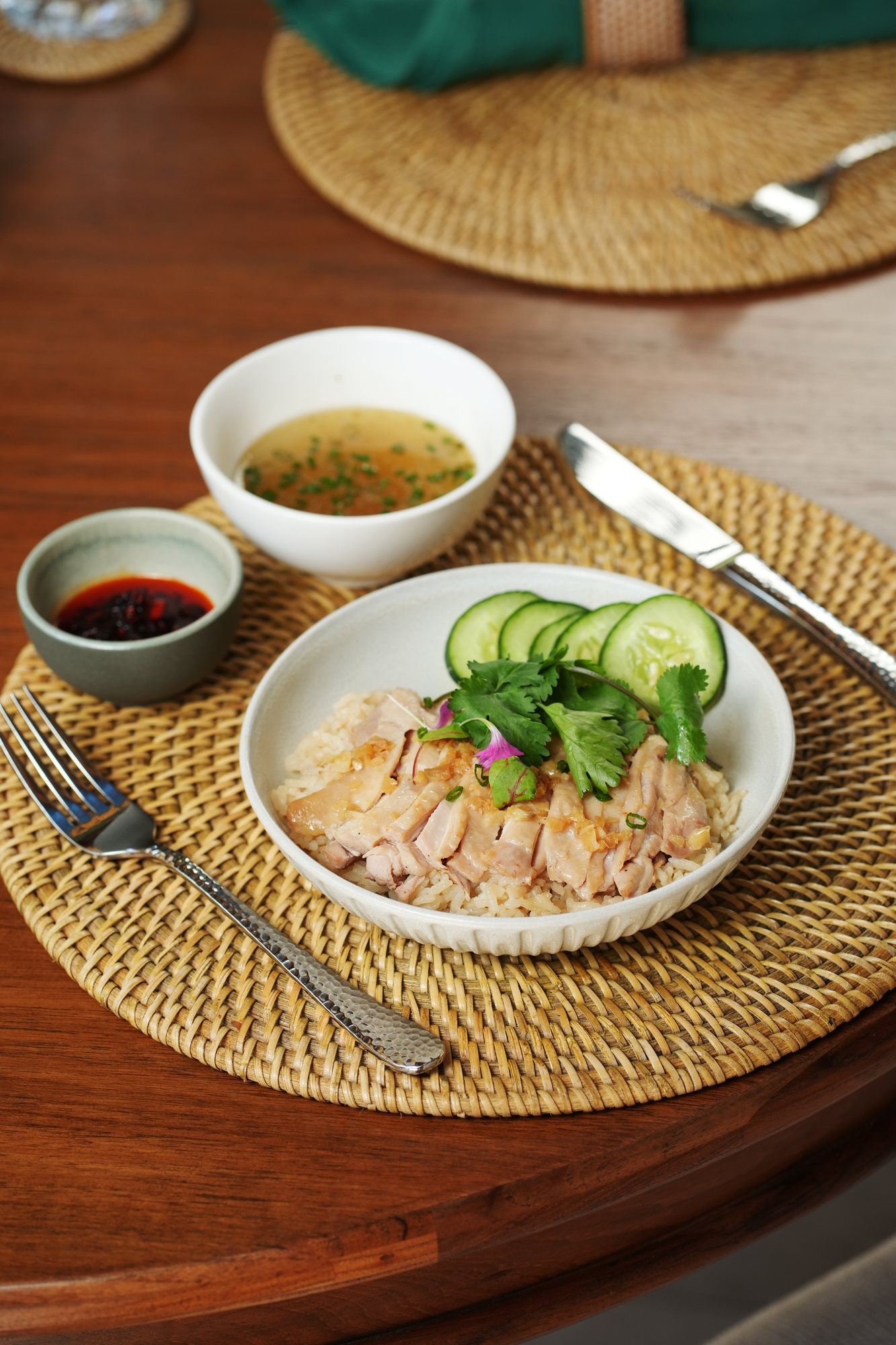 Poached chicken on seasoned rice with broth, cucumber and chilli sauce at ARUM, Paradisus by Melia Bali