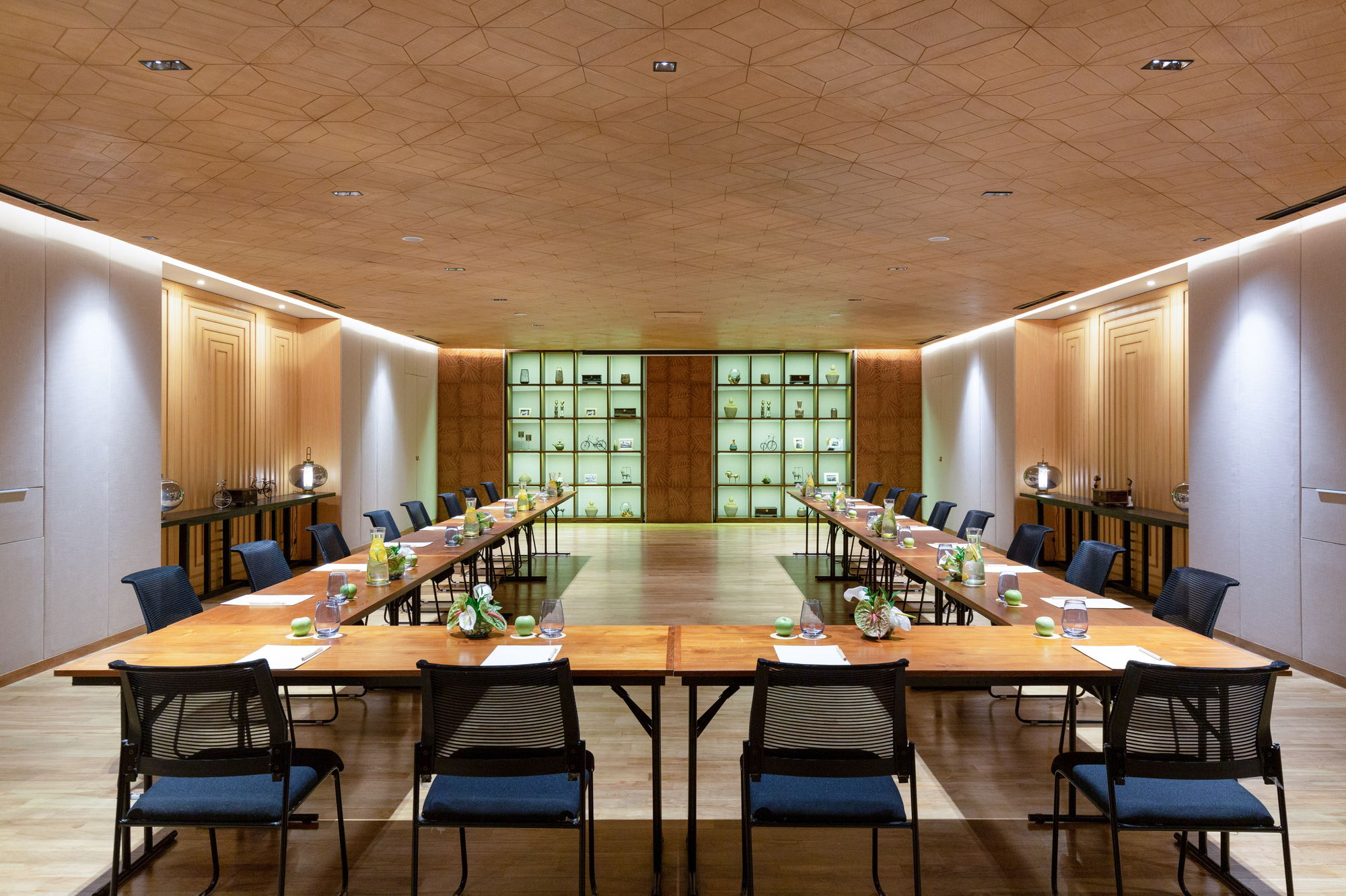 The Batur Room at Paradisus by Meliá Bali in U-shape set-up, with lit display shelving at the far end and a patterned wooden ceiling