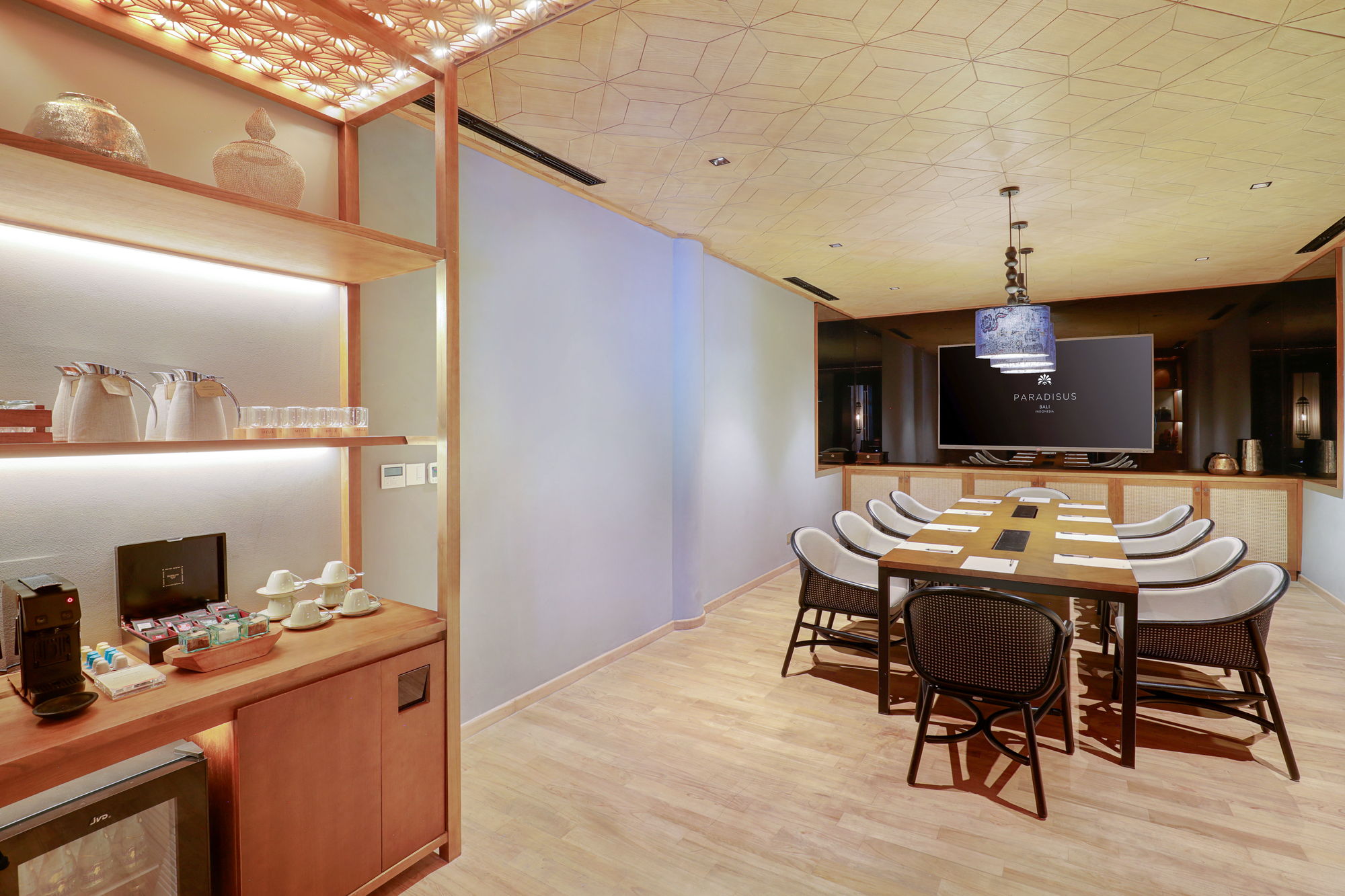 A private boardroom at Paradisus by Meliá Bali seen from the pantry side, with an espresso machine, tea selection and flasks set out for the group