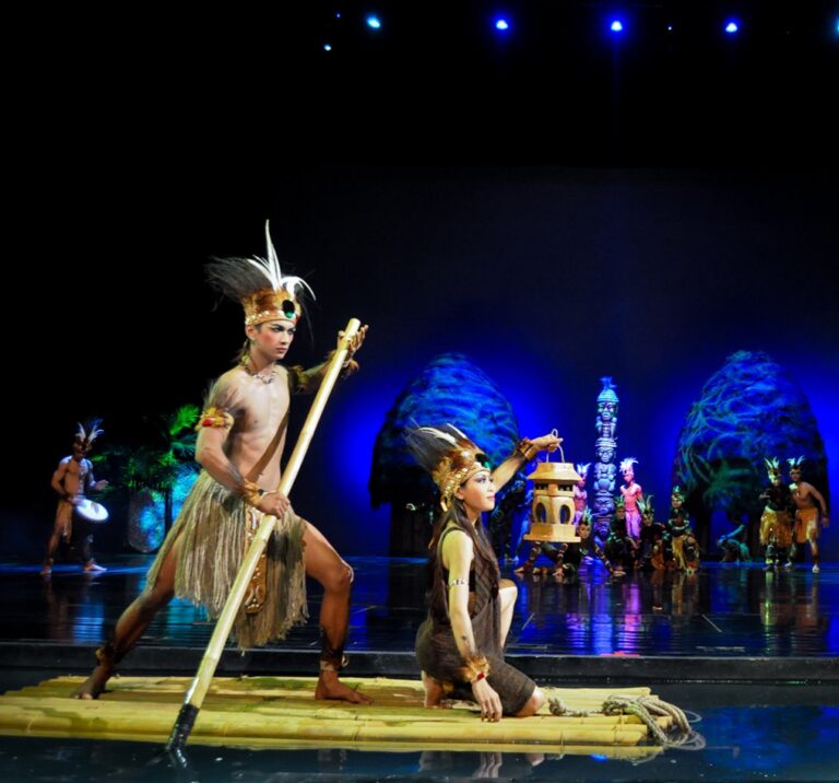 Dancers on a bamboo raft in the Devdan Show, Treasure of the Archipelago, in Nusa Dua