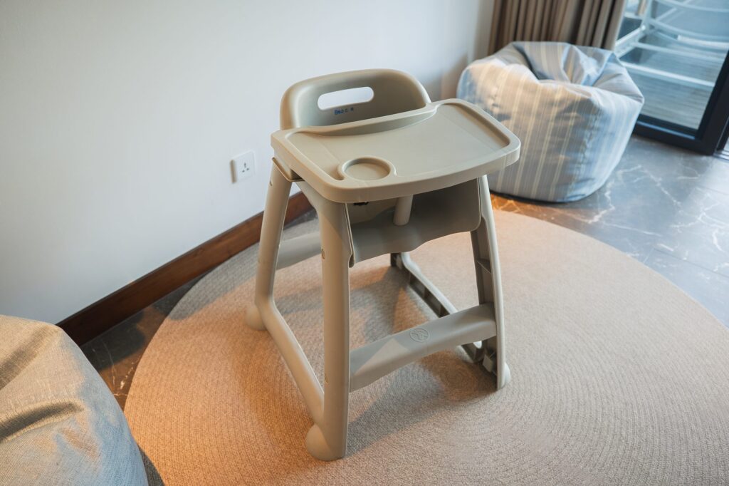 A high chair with a tray in a Family Concierge suite
