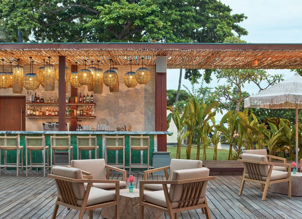 Kanna Bar at Paradisus by Meliá Bali, green-tiled counter and woven lanterns on a deck facing the garden