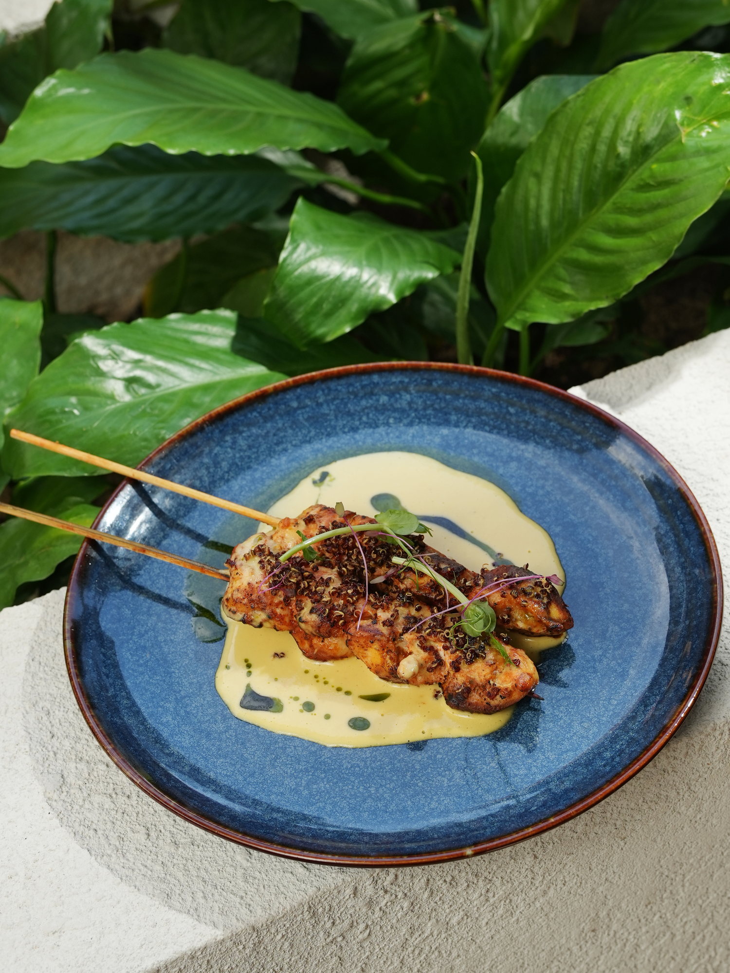 Grilled skewers crusted with quinoa on a yellow pepper sauce at Kanna Beach, Paradisus by Melia Bali