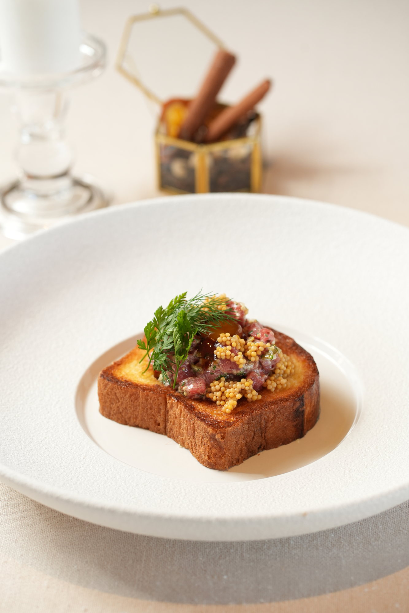 Hand-cut steak tartare with pickled mustard seeds and chervil on toasted brioche at Sante, Paradisus by Melia Bali
