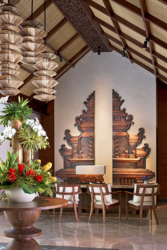 The Reserve reception, open 24 hours, with carved Balinese gate panels at Paradisus by Meliá Bali