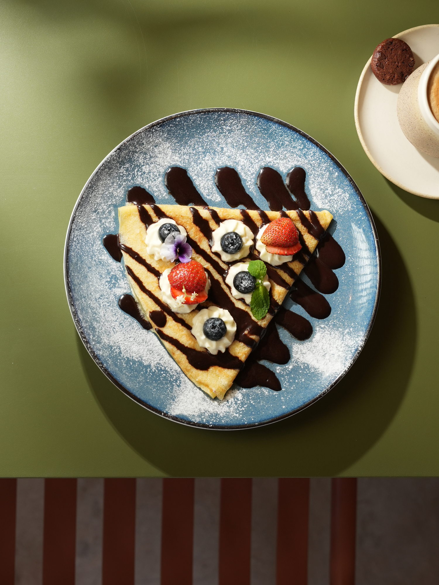 A folded crepe with chocolate sauce, cream, strawberry and blueberry at The Shack, Paradisus by Melia Bali