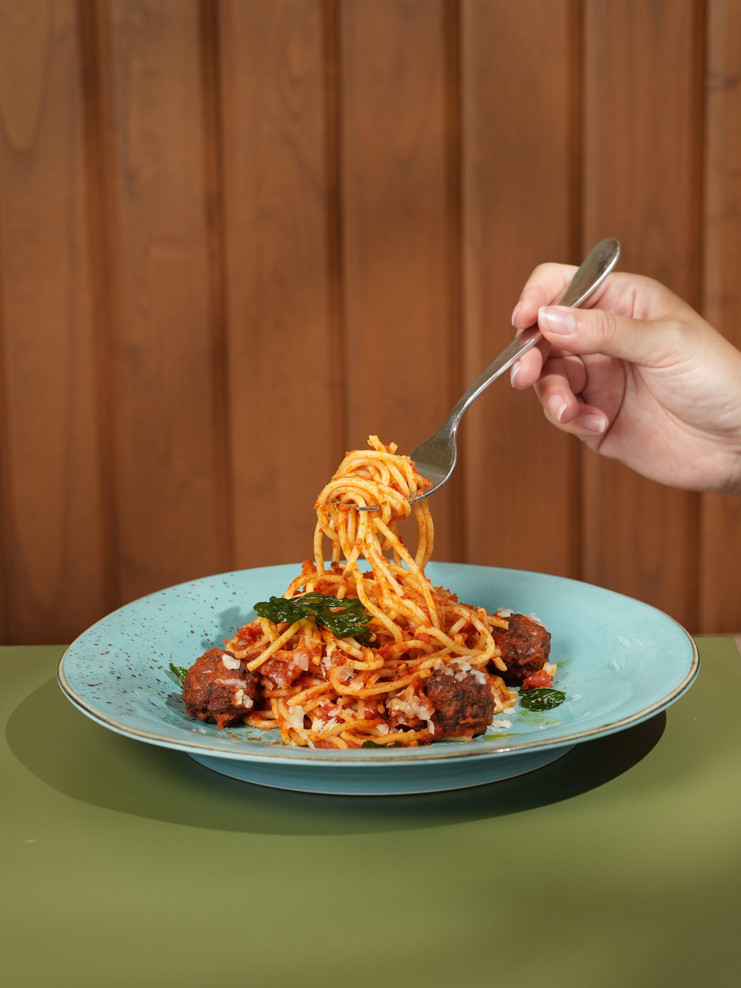 Spaghetti and meatballs in tomato sauce with parmesan and crisp basil, twirled on a fork at The Shack, Paradisus by Melia Bali