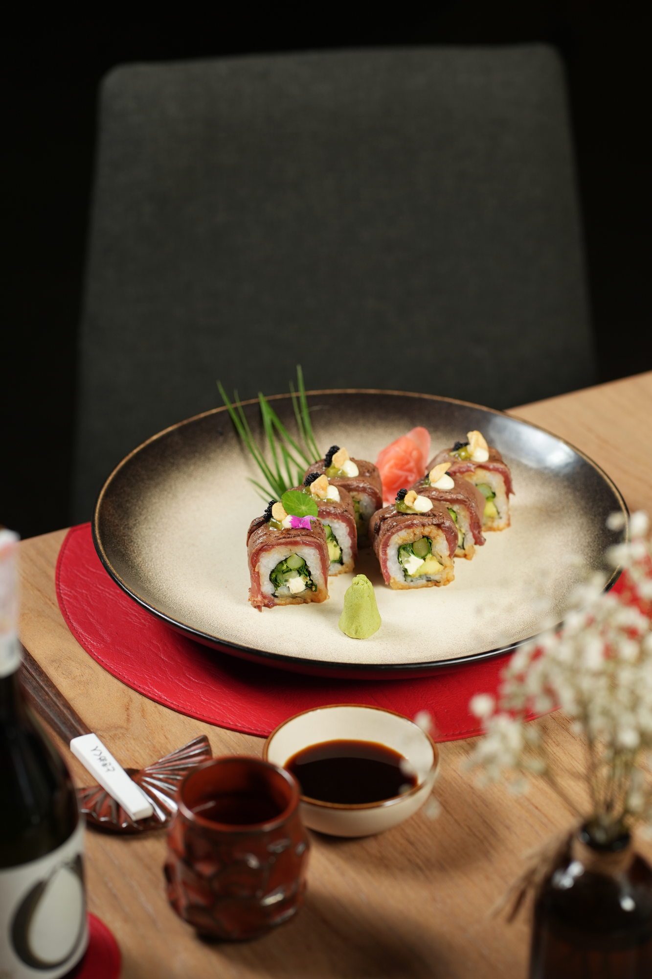 A crisp sushi roll wrapped in seared beef with cream cheese, avocado, caviar and crisp garlic at Tokimeku, Paradisus by Melia Bali