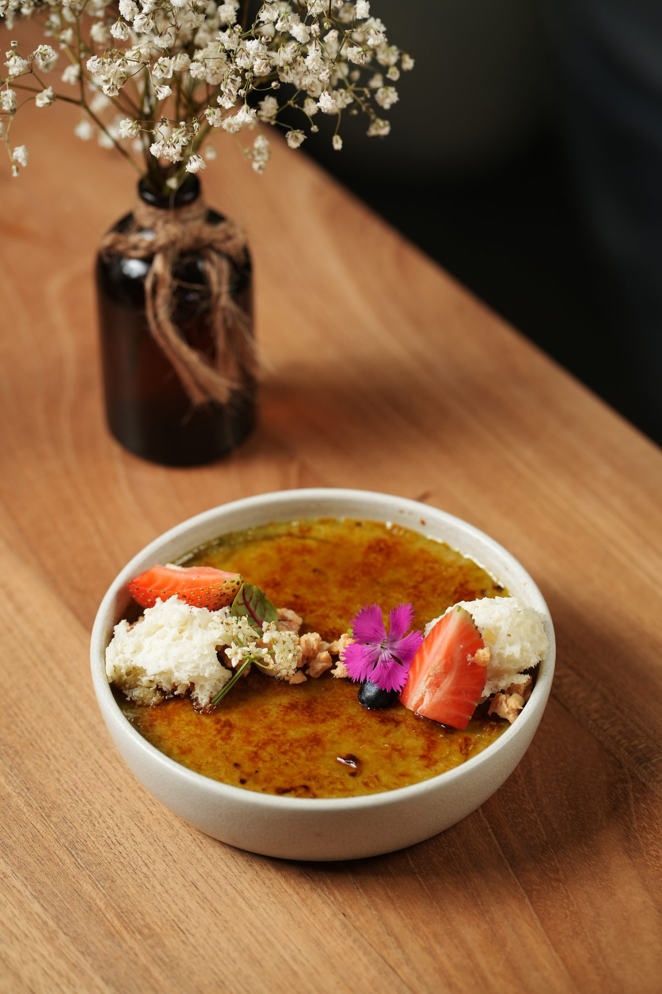 Creme brulee with strawberry, walnut crumb and a flower at Tokimeku, Paradisus by Melia Bali