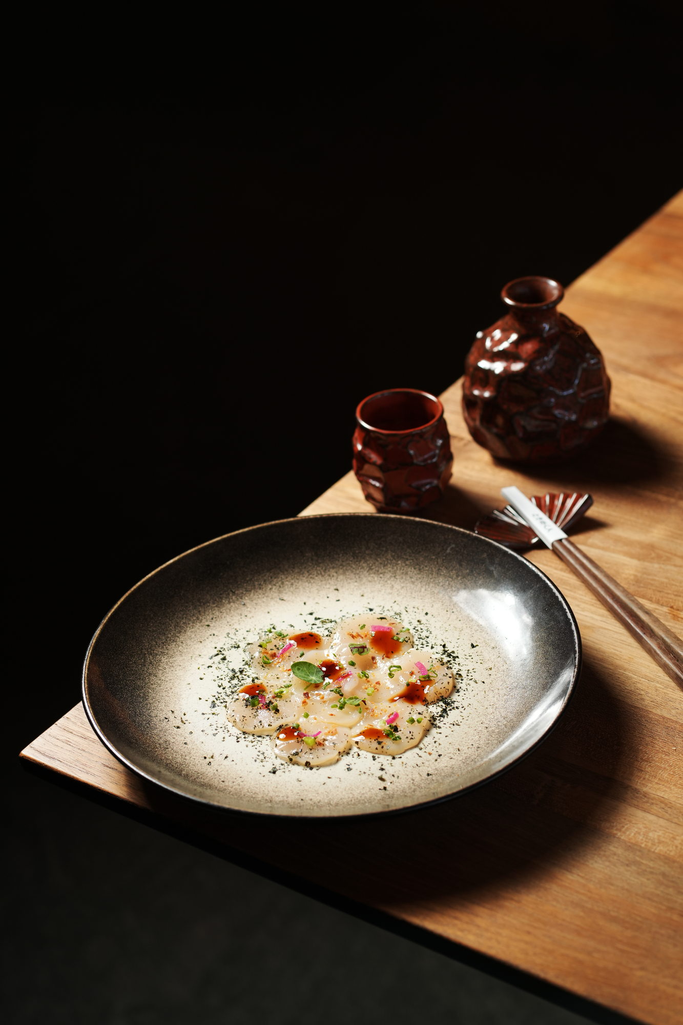 Thinly sliced scallop with nori dust, pickled shallot, spring onion and a soy dressing at Tokimeku, Paradisus by Melia Bali