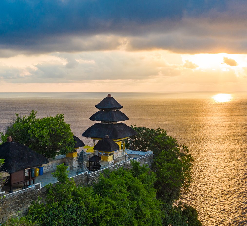 Uluwatu Temple on its clifftop above the Indian Ocean at sunset, a Destination Inclusive excursion from Paradisus by Meliá Bali